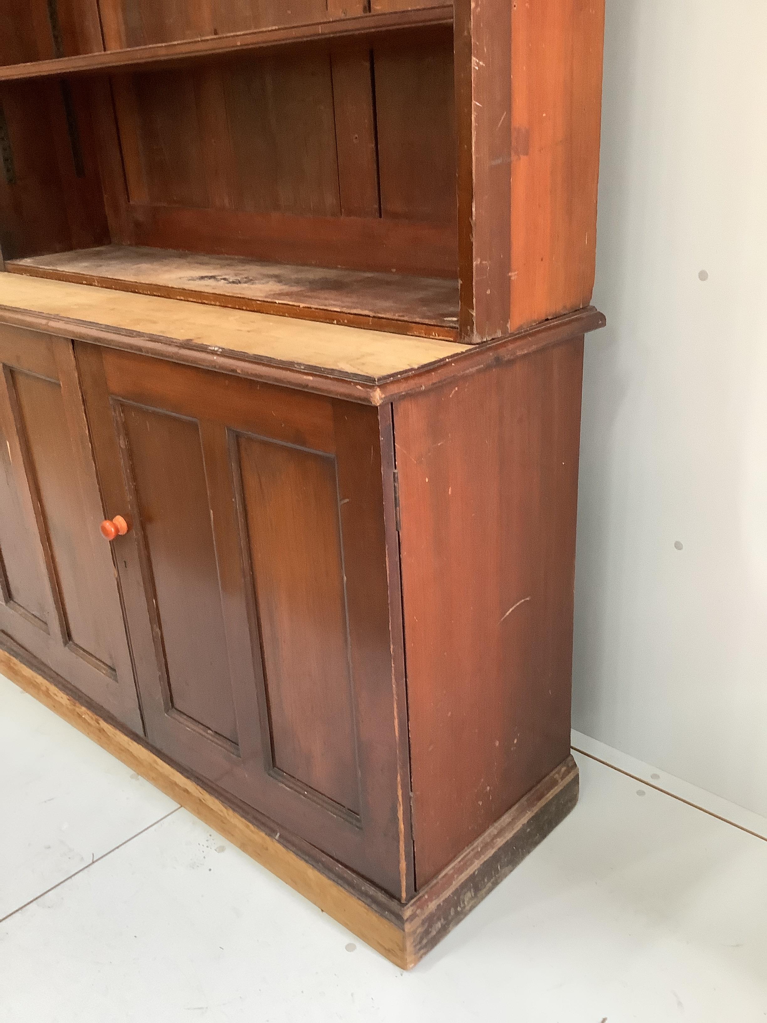 A Victorian mahogany bookcase cupboard, width 127cm, depth 47cm, height 221cm